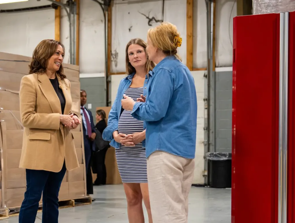 Vice President Harris speaks to two women