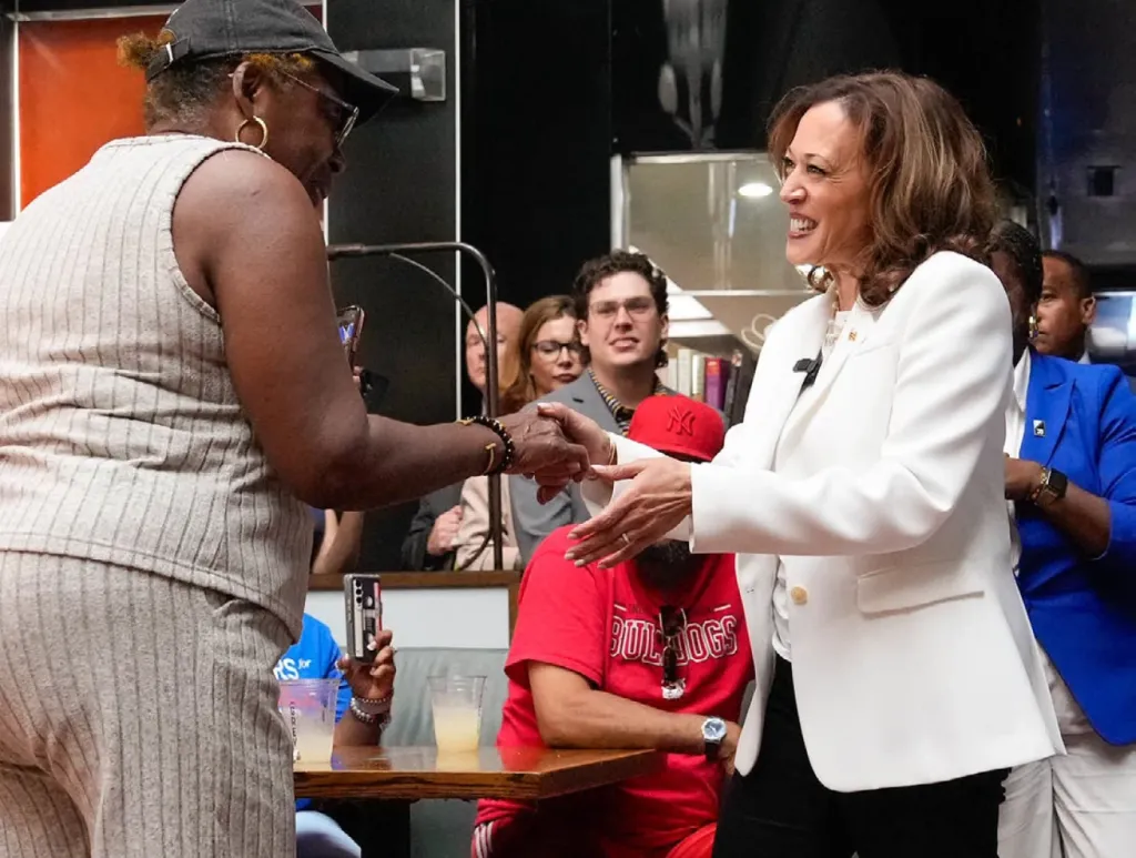 Vice President Harris shakes hands with a woman